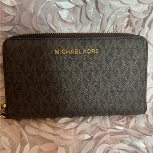 Micheal Kors large monogram wallet with wrist band